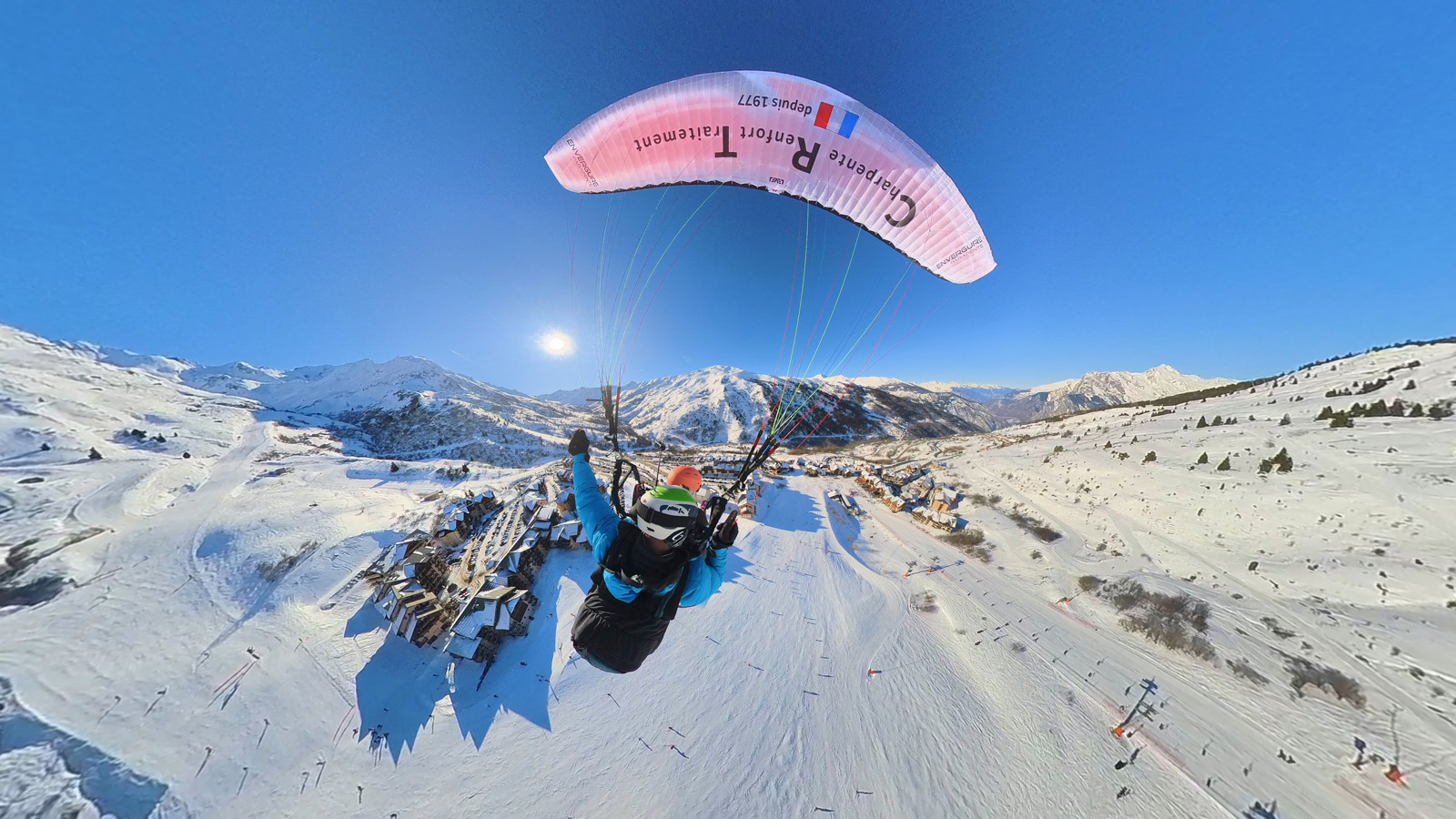 Tandem paragliding flight with views of Valmeinier